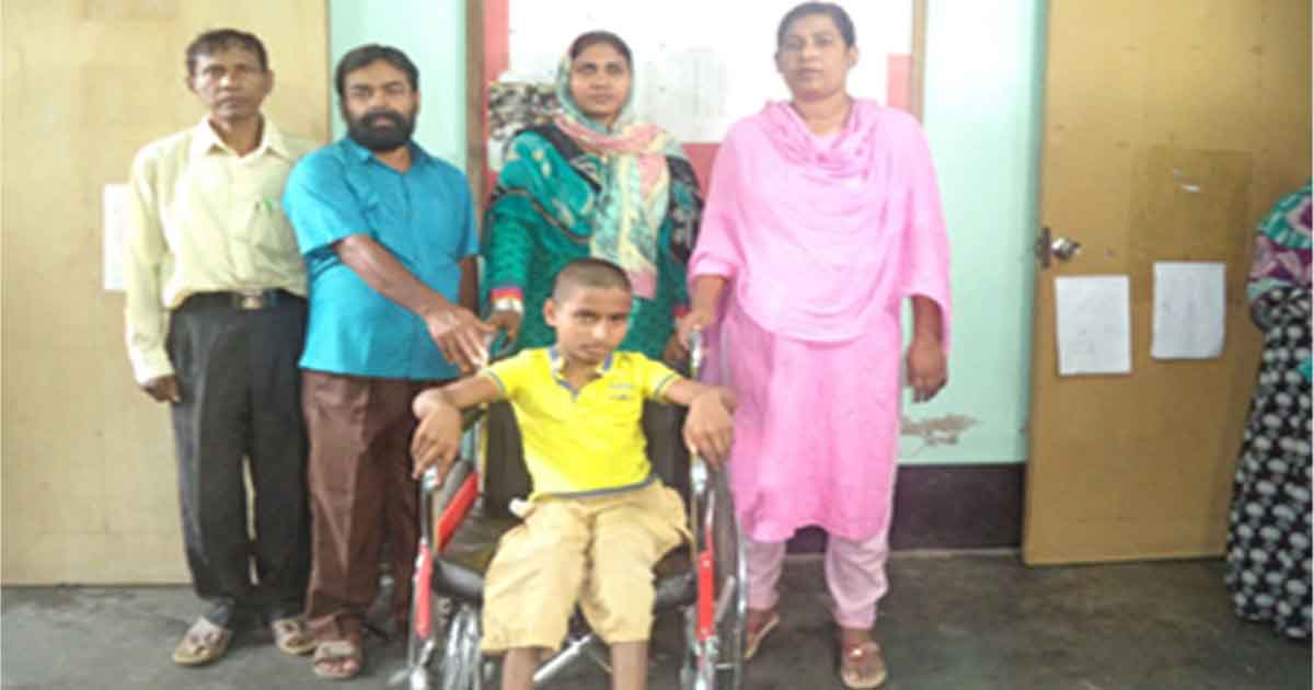 A wheel chair is given to a student from BASCO Foundation.